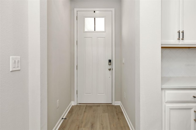 entryway with light hardwood / wood-style floors