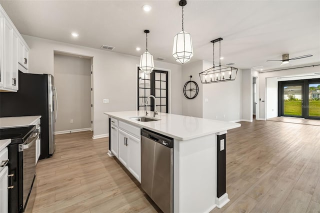 kitchen with white cabinetry, sink, black range with electric cooktop, stainless steel dishwasher, and a center island with sink