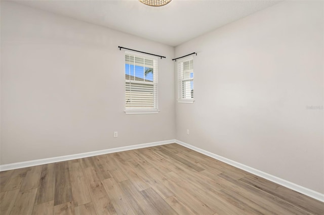 unfurnished room featuring light hardwood / wood-style flooring