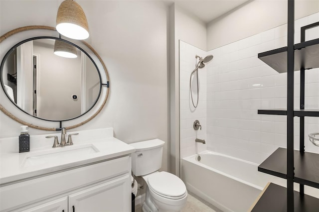 full bathroom with toilet, vanity, and tiled shower / bath