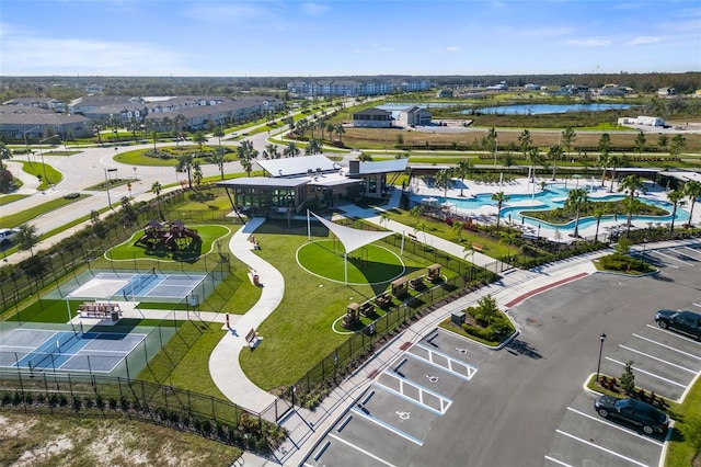 birds eye view of property featuring a water view