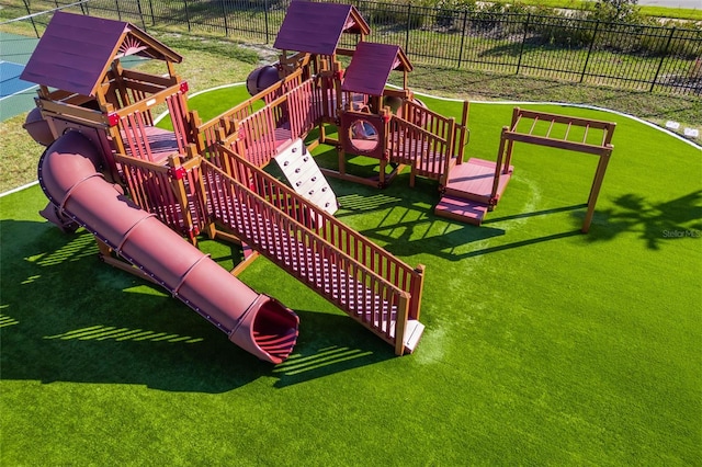 view of playground with a lawn