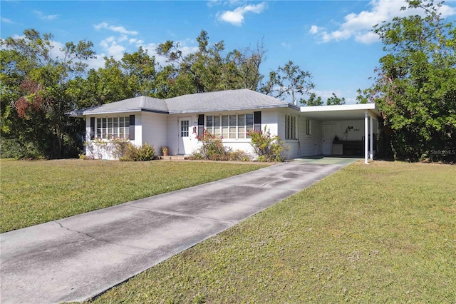 ranch-style home with a front lawn and a carport