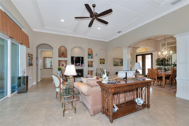 living room featuring french doors, built in features, light tile patterned floors, ceiling fan with notable chandelier, and ornamental molding