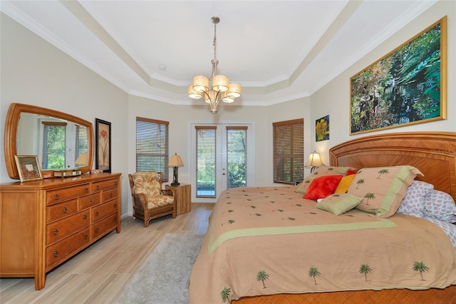 bedroom featuring access to exterior, ornamental molding, and light hardwood / wood-style flooring