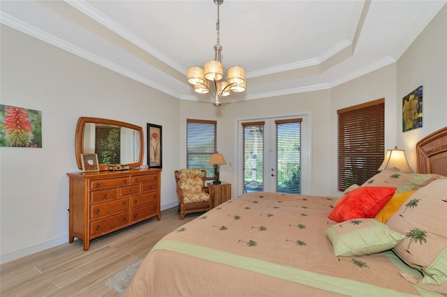 bedroom with access to outside, crown molding, french doors, and light hardwood / wood-style floors