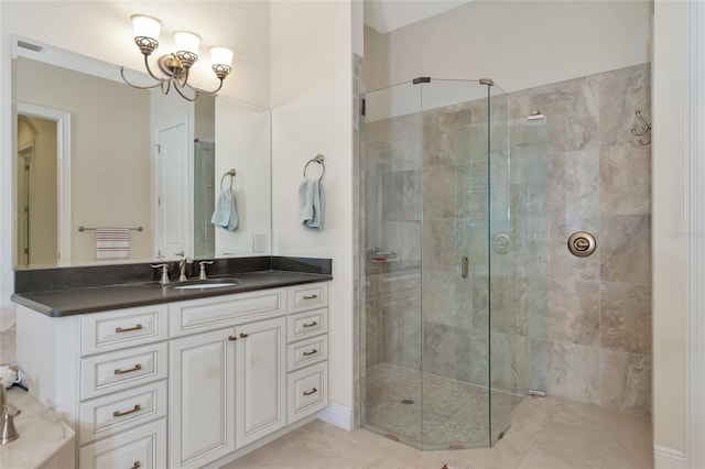 bathroom with vanity, tile patterned floors, and a shower with door