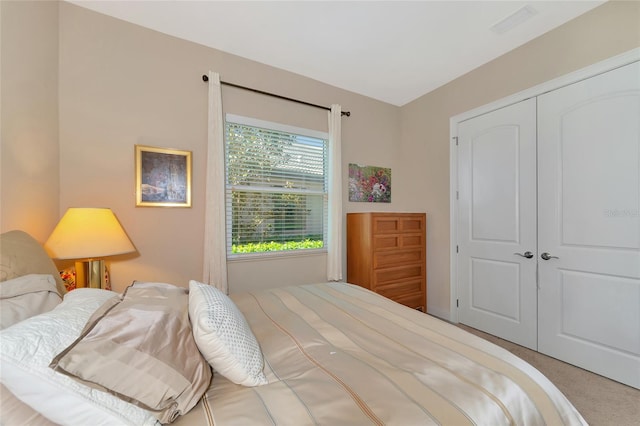 bedroom with carpet flooring and a closet