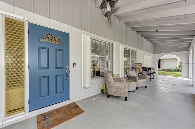 doorway to property featuring covered porch