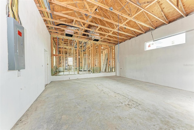 basement with a healthy amount of sunlight and electric panel