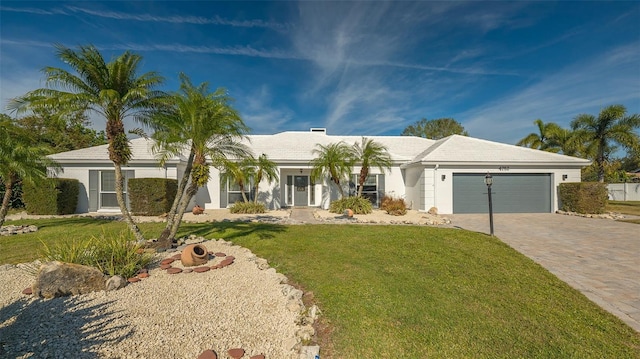 ranch-style house with a front lawn and a garage