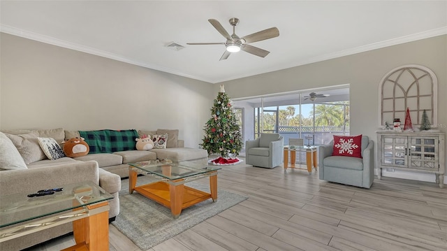 living room with ceiling fan, ornamental molding, and light hardwood / wood-style flooring