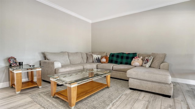 living room featuring light wood-type flooring and ornamental molding