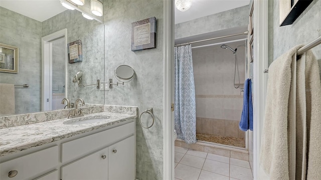 bathroom featuring tile patterned floors, vanity, and walk in shower