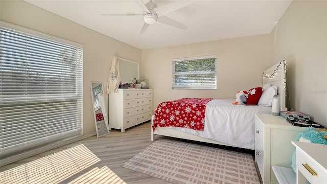 bedroom featuring ceiling fan and light hardwood / wood-style floors