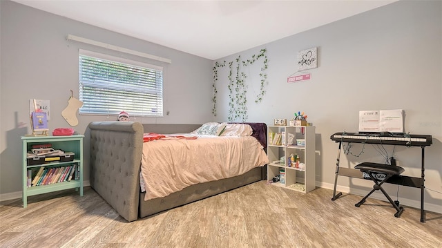 bedroom with wood-type flooring