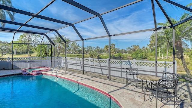 view of pool with glass enclosure, an in ground hot tub, and a patio area