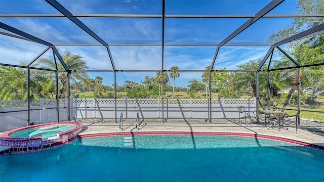 view of pool with a lanai, a patio, and an in ground hot tub