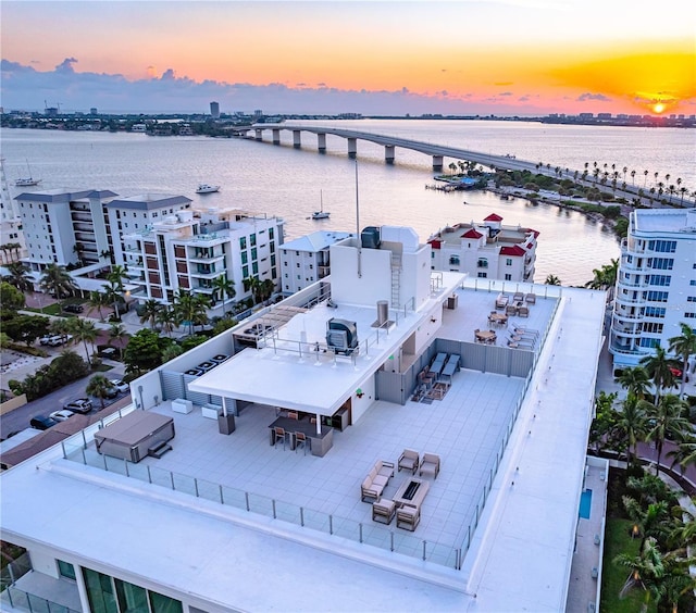 aerial view at dusk with a water view