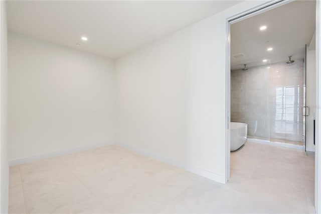 unfurnished room with tile walls