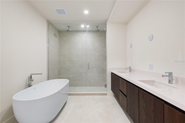 bathroom with separate shower and tub, tile patterned flooring, and vanity