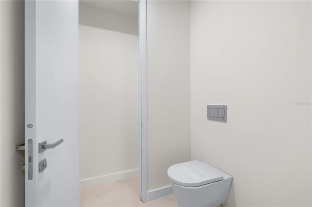 bathroom featuring tile patterned floors and toilet