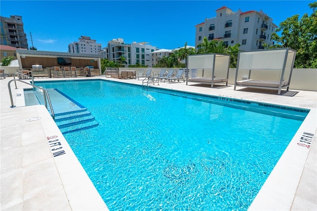 view of swimming pool with a patio area