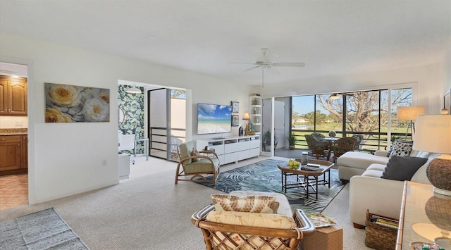 living room with ceiling fan and light colored carpet