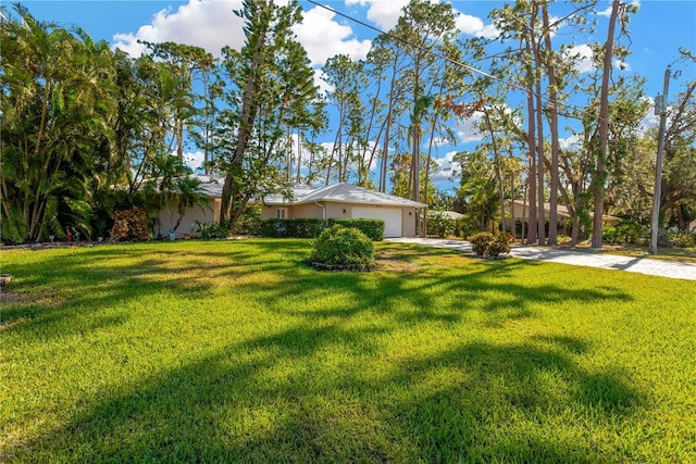 view of yard with a garage