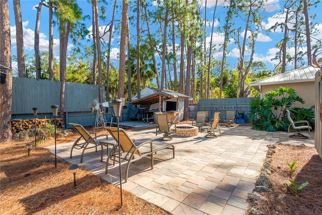 view of patio featuring an outdoor fire pit