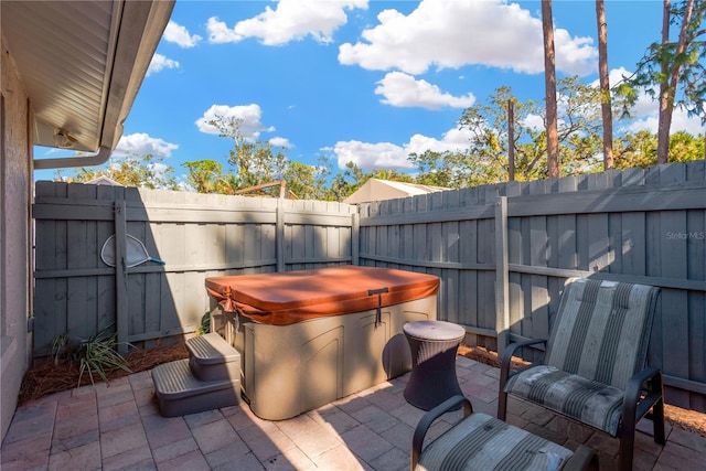 view of patio with a hot tub