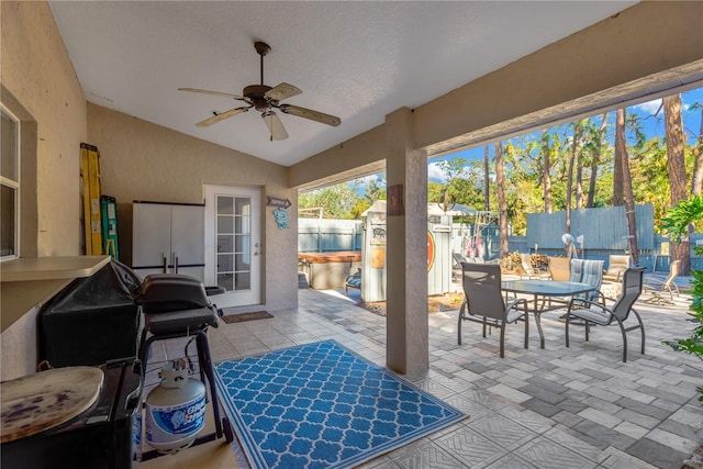 view of patio featuring ceiling fan and a hot tub