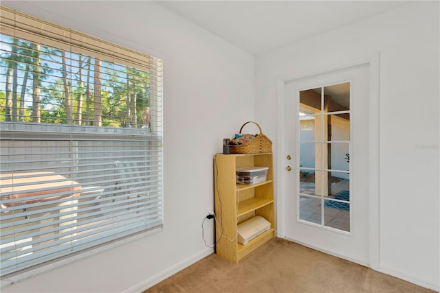 interior space featuring light colored carpet