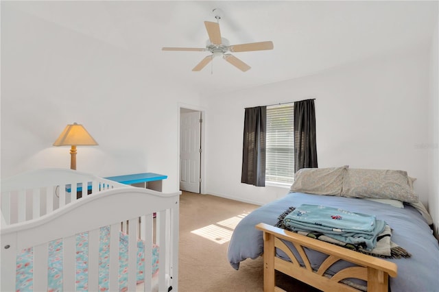 bedroom with light colored carpet and ceiling fan