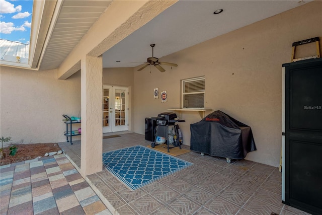 view of patio featuring french doors, ceiling fan, and a grill