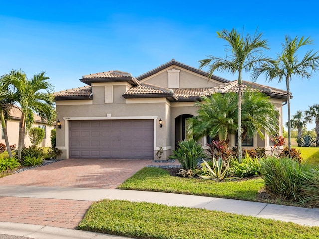 mediterranean / spanish-style house featuring a garage