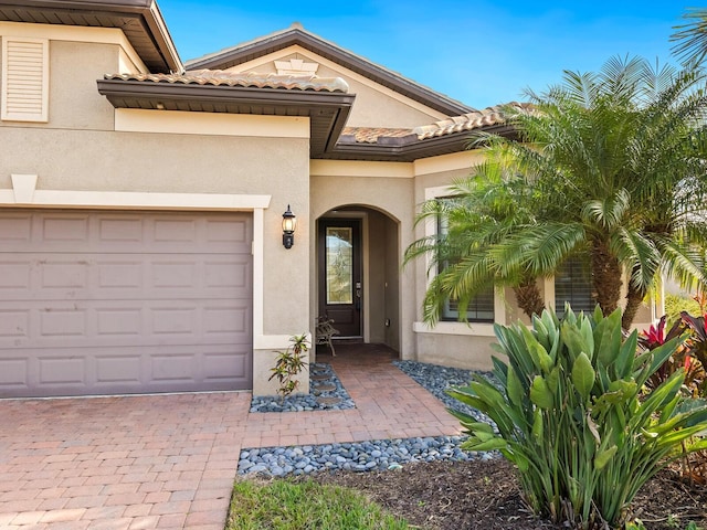 doorway to property featuring a garage