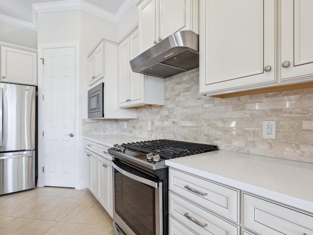 kitchen with backsplash, white cabinetry, and stainless steel appliances