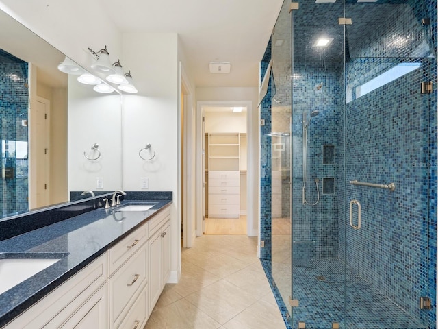 bathroom with vanity, tile patterned floors, and walk in shower