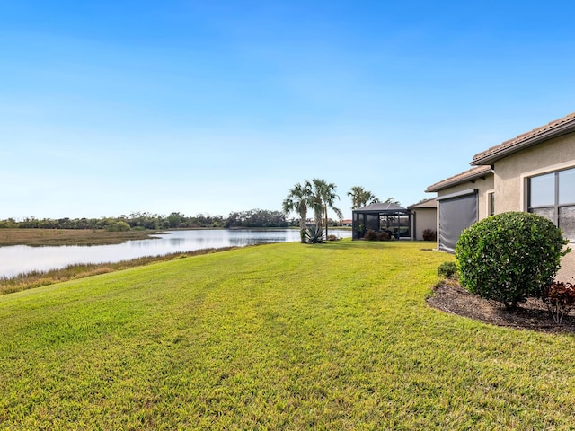 view of yard with a water view