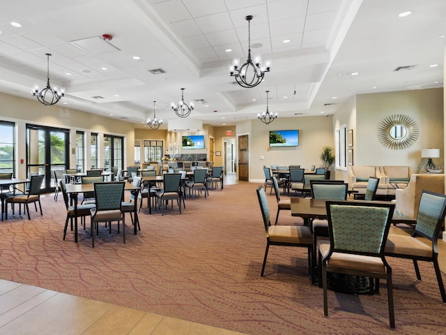 carpeted dining area featuring a raised ceiling and crown molding