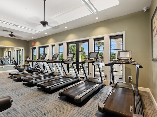 gym with ceiling fan and carpet floors