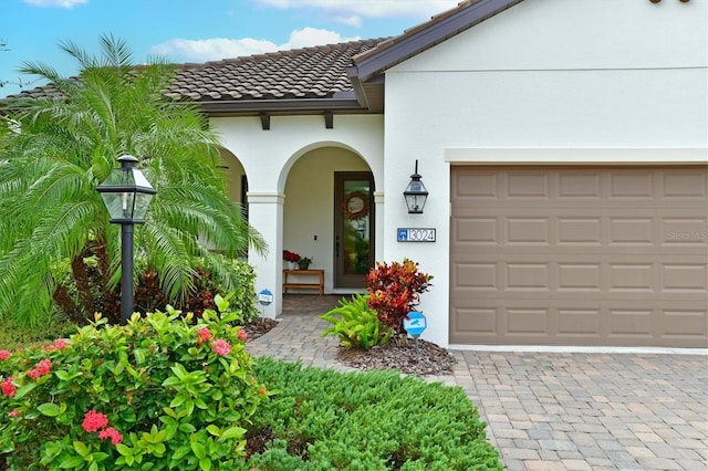 doorway to property featuring a garage