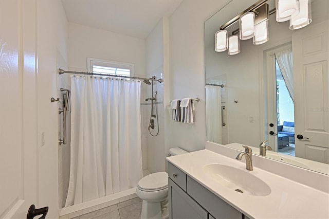 bathroom featuring vanity, tile patterned flooring, a shower with curtain, and toilet