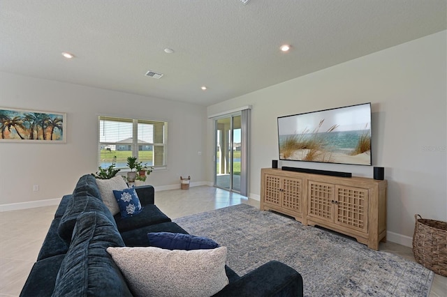 tiled living room with a textured ceiling