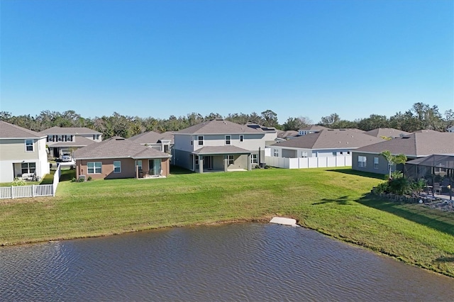 exterior space with a water view and a yard