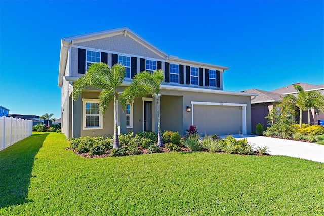 view of front of home featuring a front yard and a garage