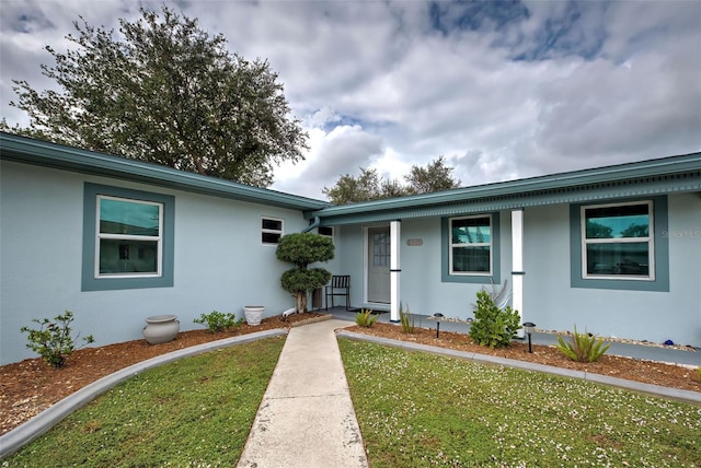 exterior space featuring a front yard and covered porch