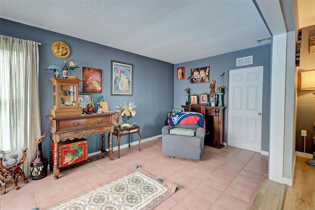 living area with light tile patterned floors