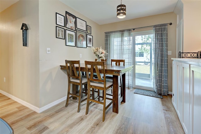 dining area with light hardwood / wood-style floors